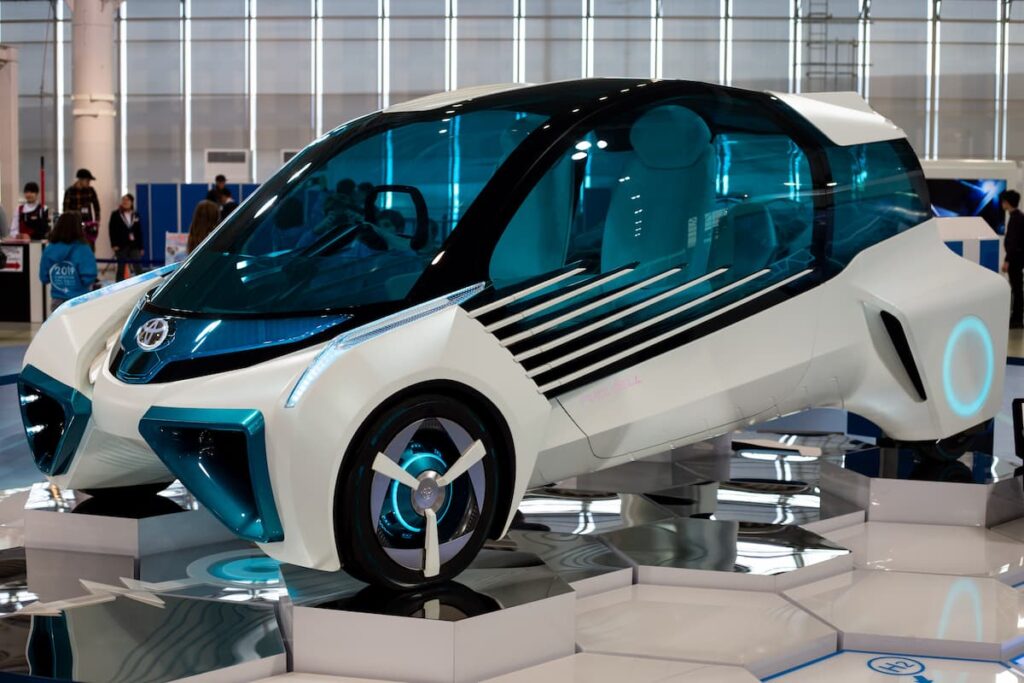 White hydrogen car for two people on display at a fair