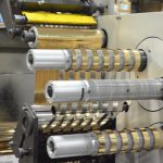 ProÂ® Sheen being slit on a narrow web slitter