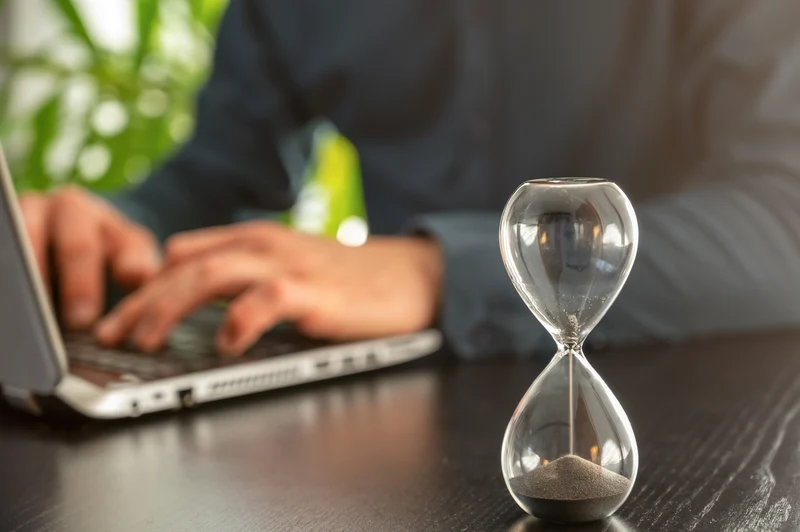 An hourglass indicates time has almost run out