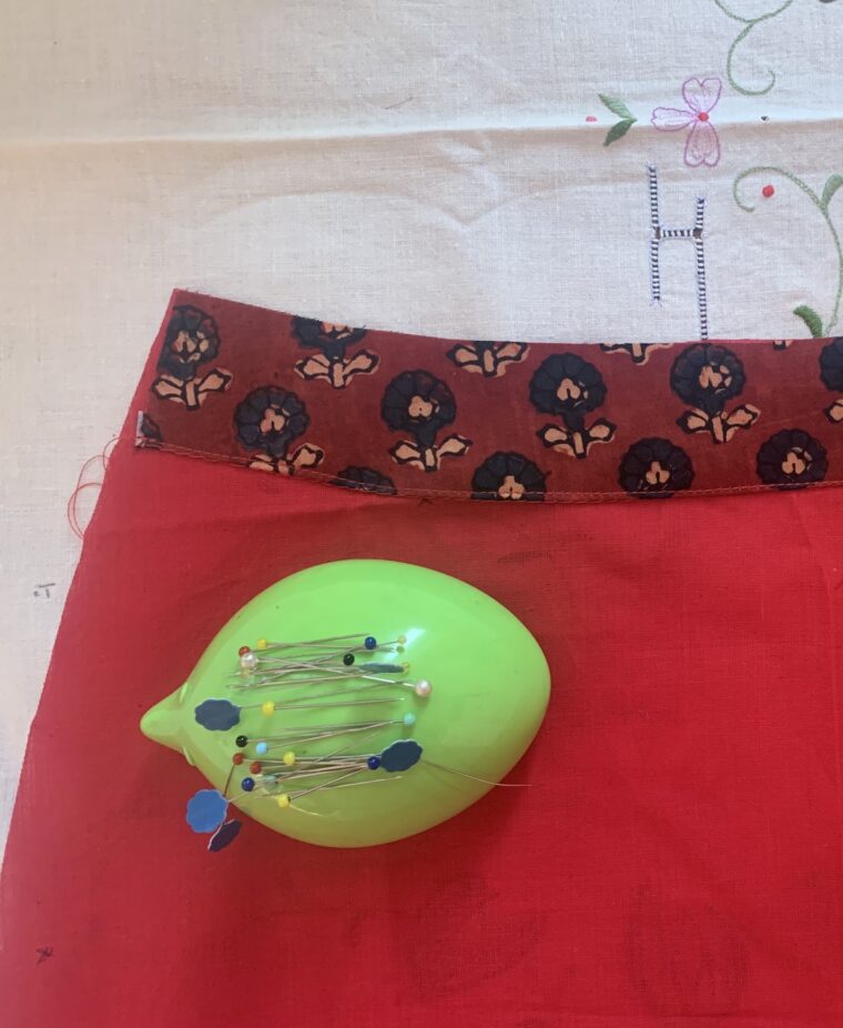 Edge-stitching facing to lining