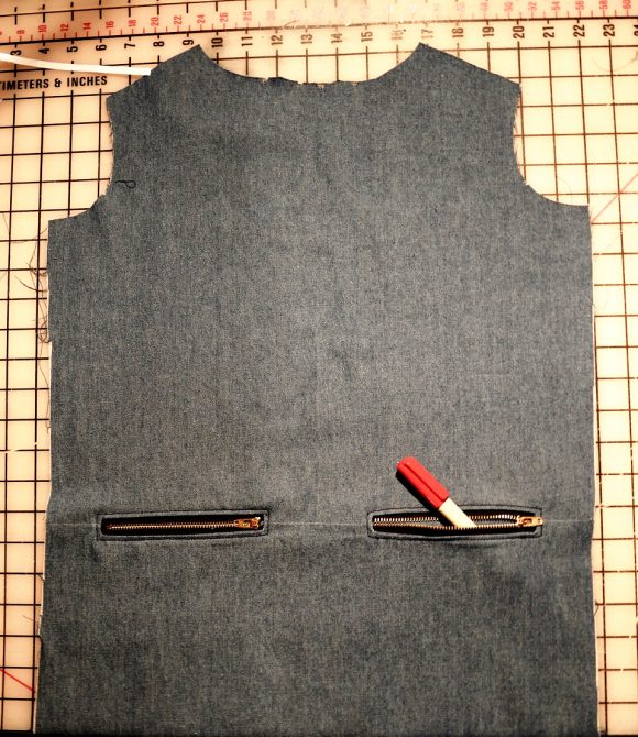 exposed zippers on welt pockets