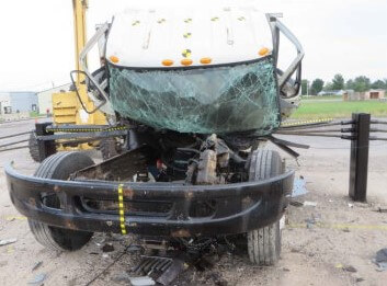 a 15,000 pound truck crashing into a security fence