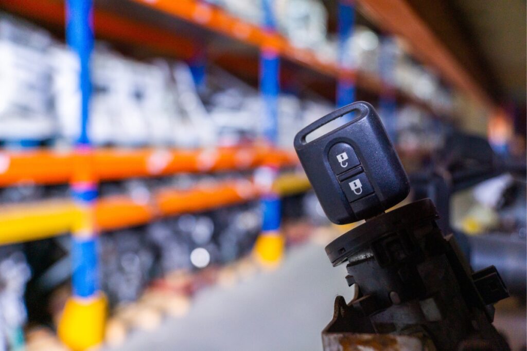 An assortment of ignition barrels and tools stored in a warehouse.