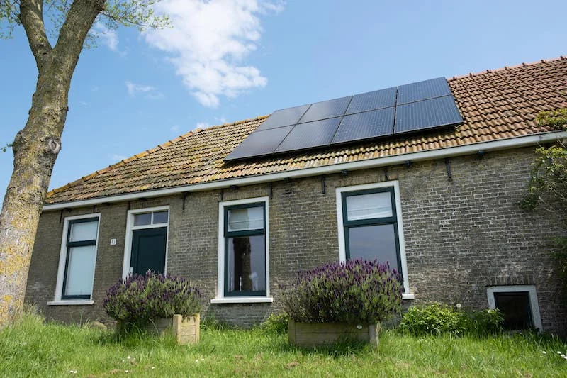 Solar panels are absorbing sunshine on the roof.