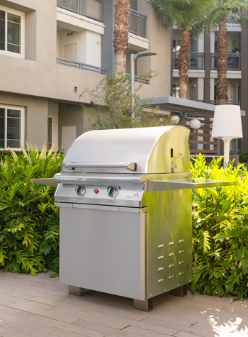 stainless steel electric patio grill on pedestal