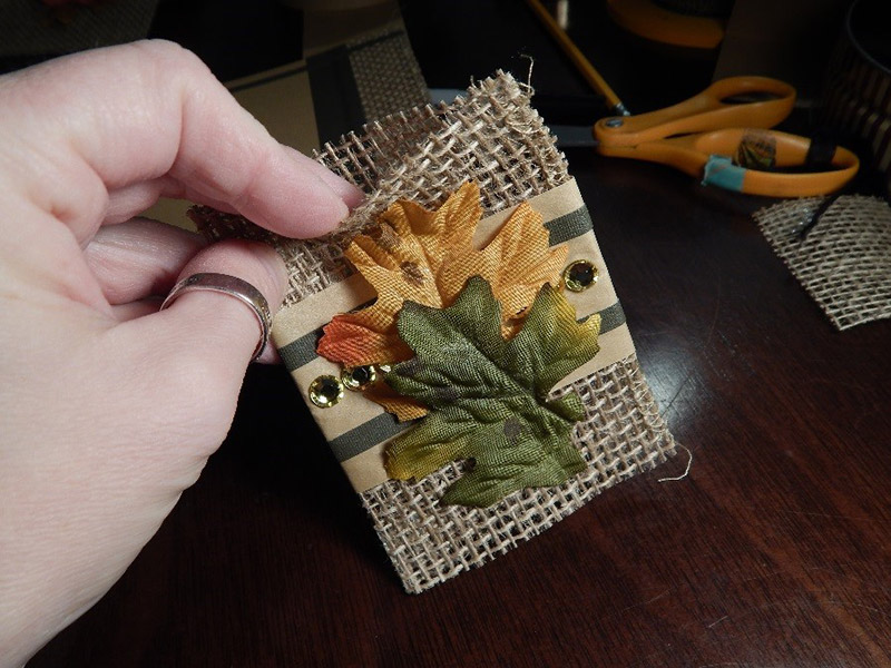 The utensil holders are just pieces of burlap folded in half like a birthday card. I secured the one longer end with UGluÂ®, leaving the top and bottom open so I can slip the utensils right in. Essentially, itâ€™s like a pouch.