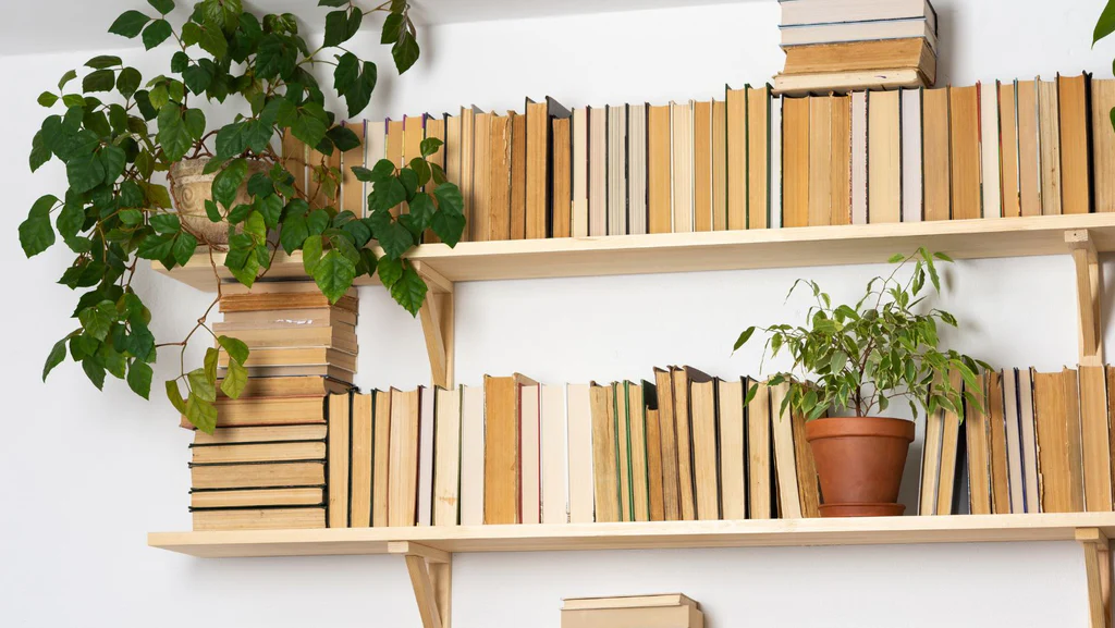 Floating shelves with antique books on display