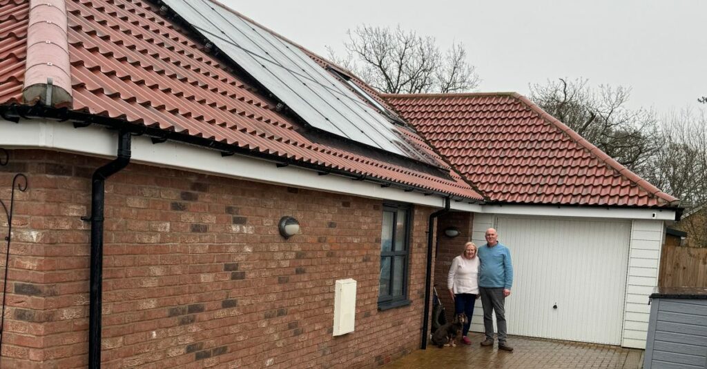 Picture of Solar Together Participants standing in front of their solar powered home