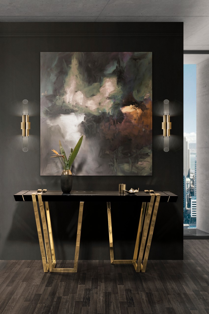 luxury entryway with a black and gold console table