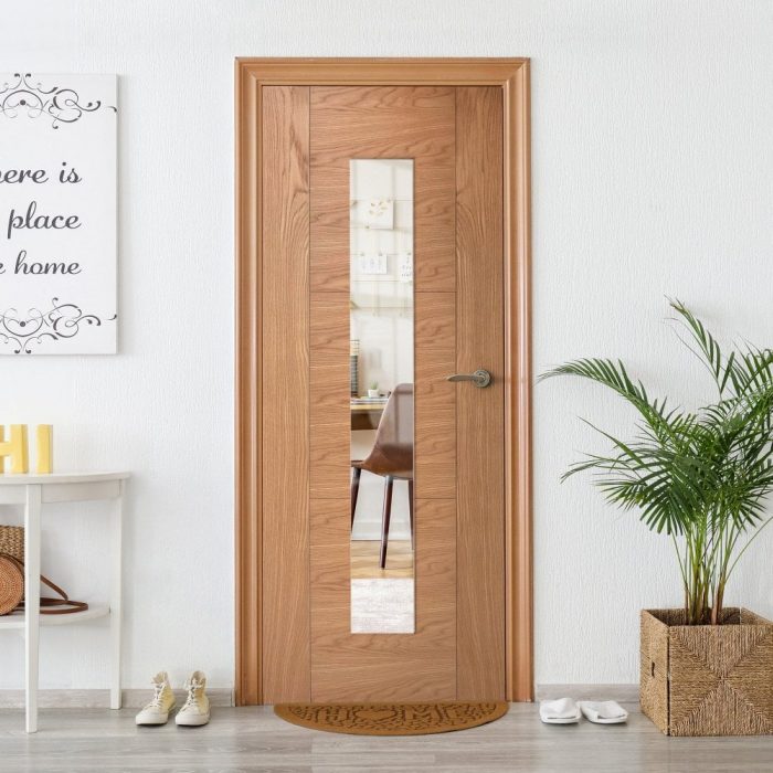 A wooden internal door with a glass panel