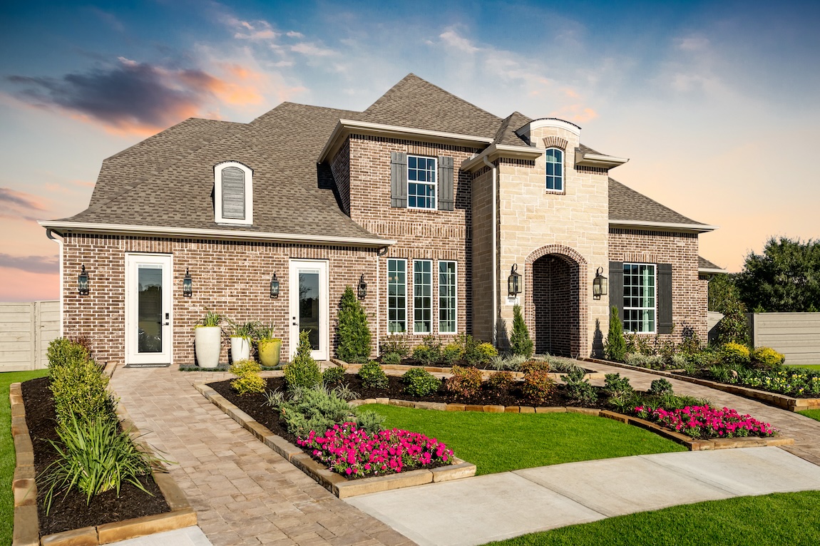 luxurious home design showcasing classic exterior and enhanced landscaping in Manvel, Texas