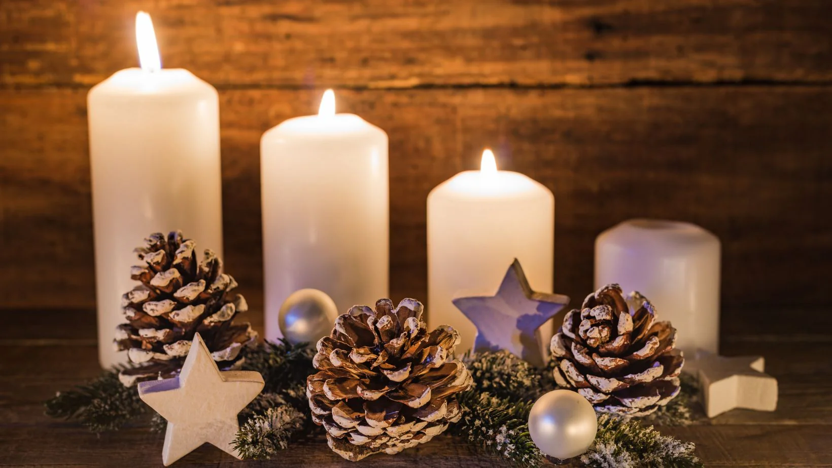 Four candles of varying heights