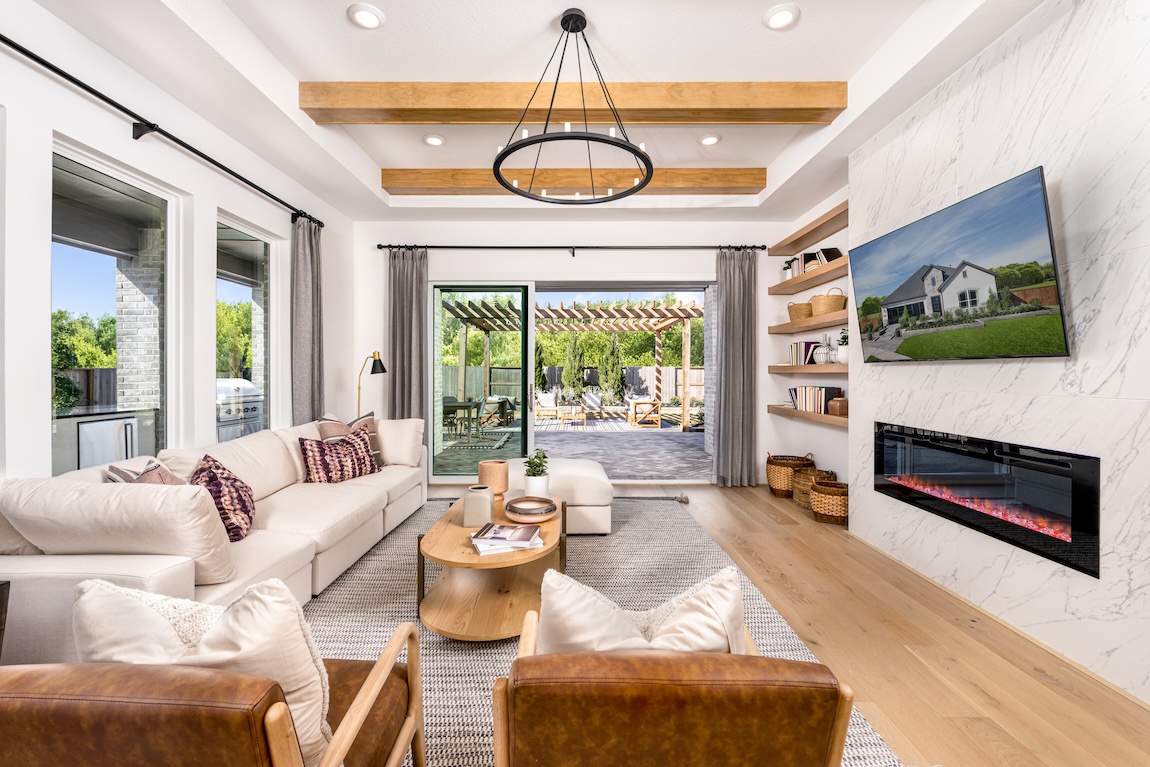 luxurious interior design with indoor-outdoor transitions, wooden ceilings, and contemporary fireplaces