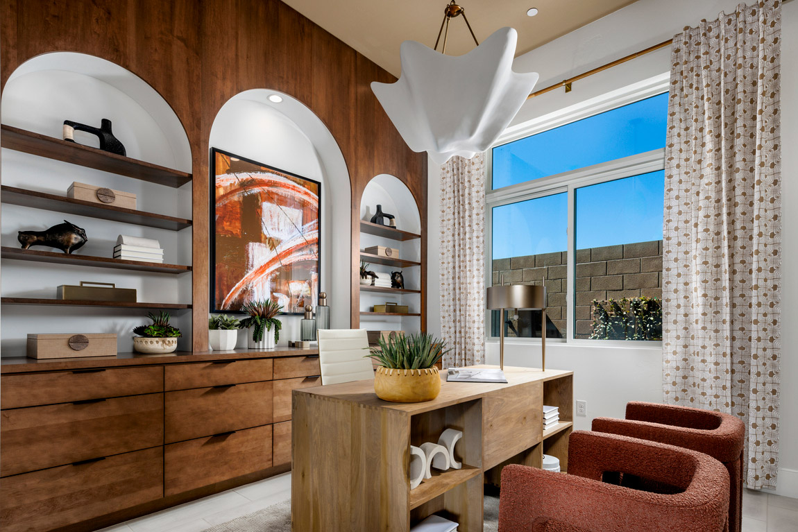 At-home office with built-in curved shelving, and mid-century modern retro design.
