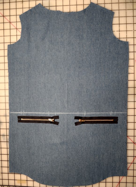 exposed zippers on welt pockets