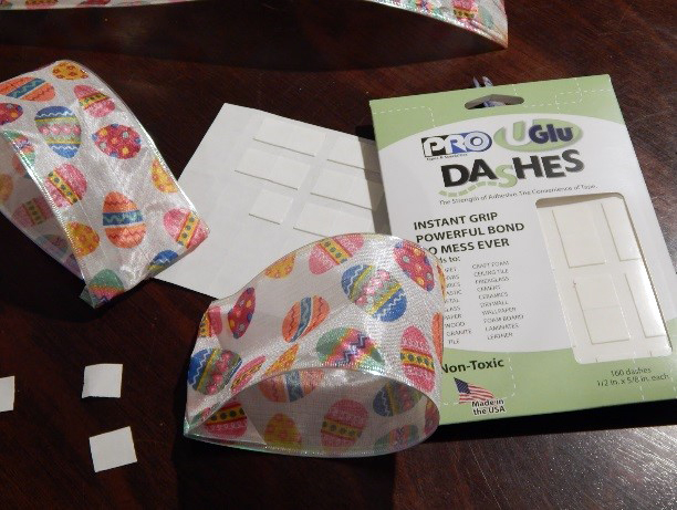 Loop the shorter pieces of ribbon ends together and affix with one UGluâ“‡ Dash