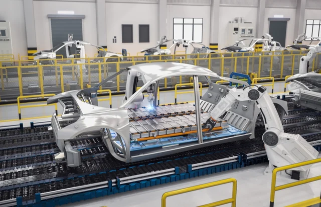 A manufacturing plant showing how EV batteries are installed in new cars.