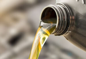 motor oil being poured out of the bottle