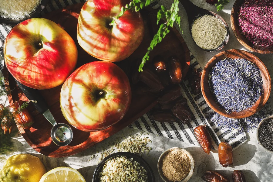 Ingredients for caramel apple bites sit out on a countertop in the sunshine