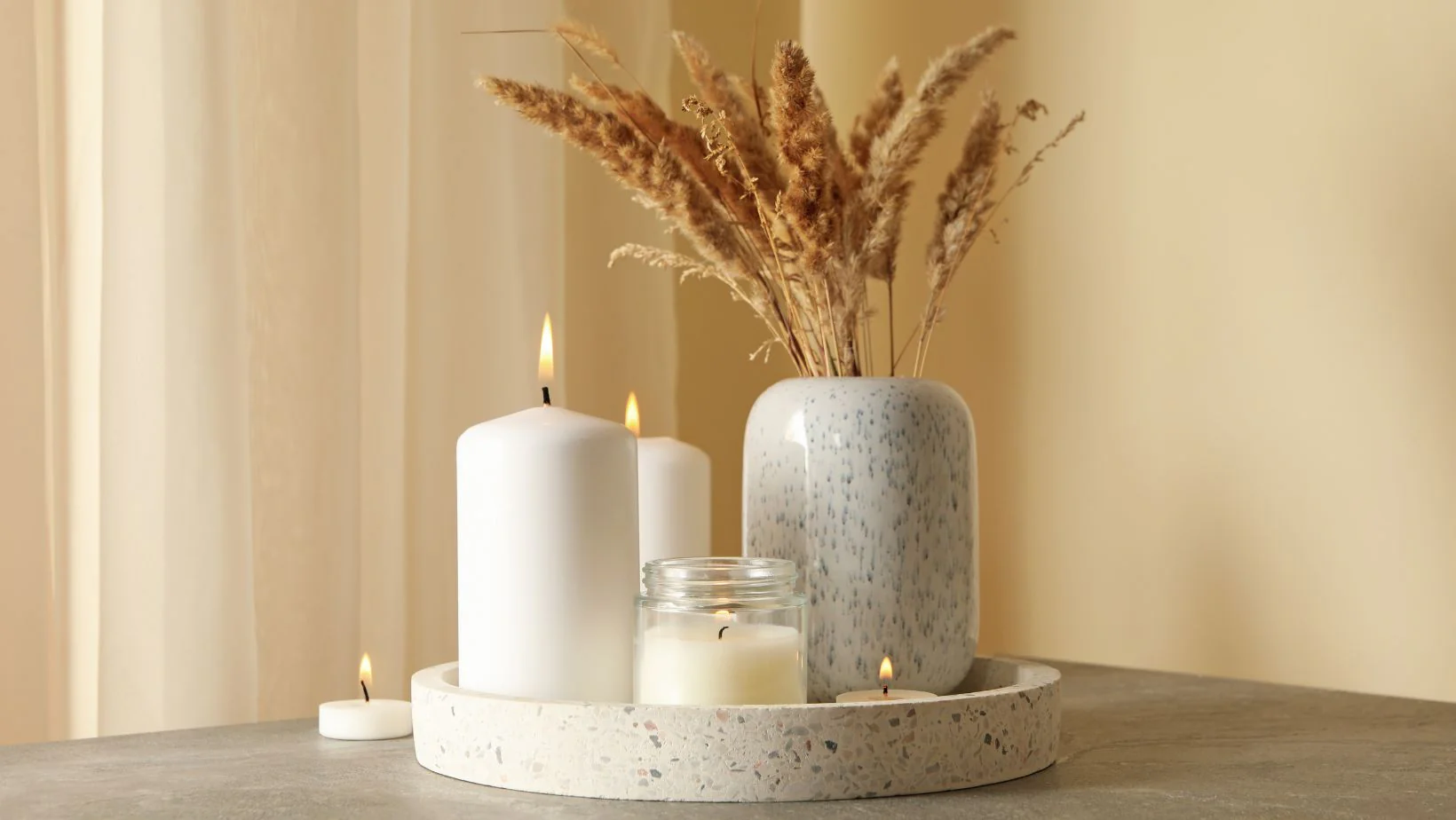 A group of candles on a candle holder
