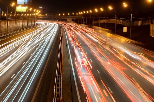 Many cars on a busy road.