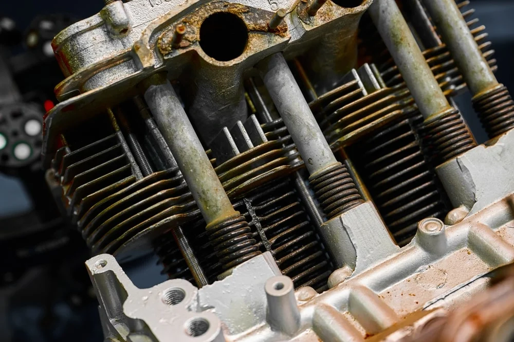 Old internal combustion engine of car with rust.