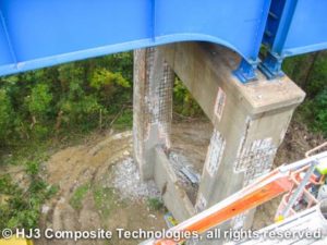 Cement crumbling around exposed rebar