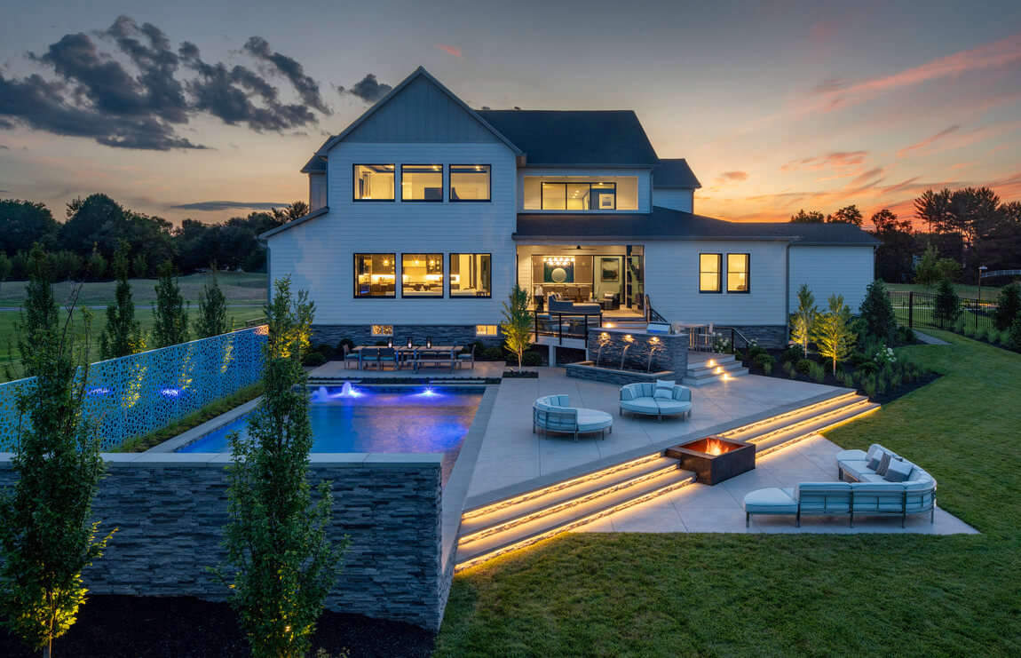 Modern luxury backyard with stunning outdoor lighting