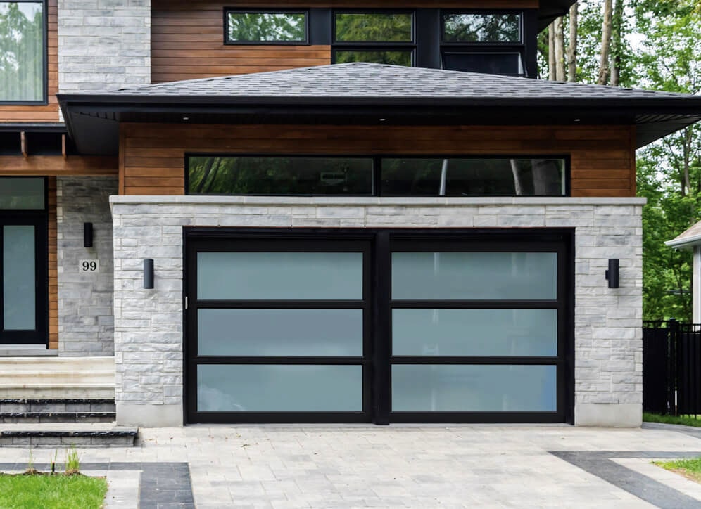 A full glass garage door with black framing