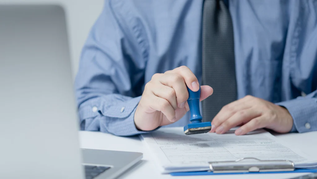 Man sealing documents