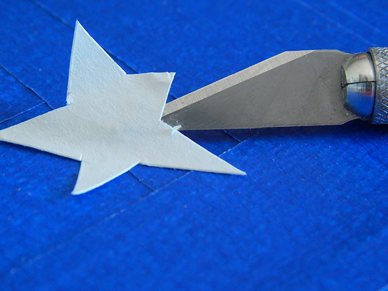 Peel and place the white stars.