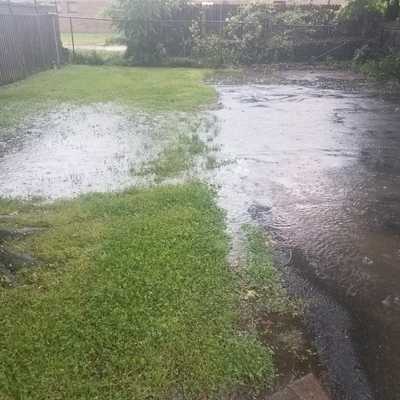 flooded driveway image for driveway drainage blog post
