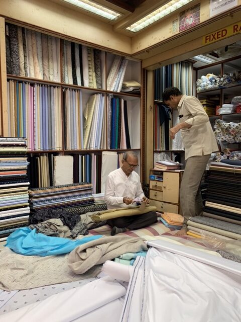 Two textile merchants in Mumbai fabric shop