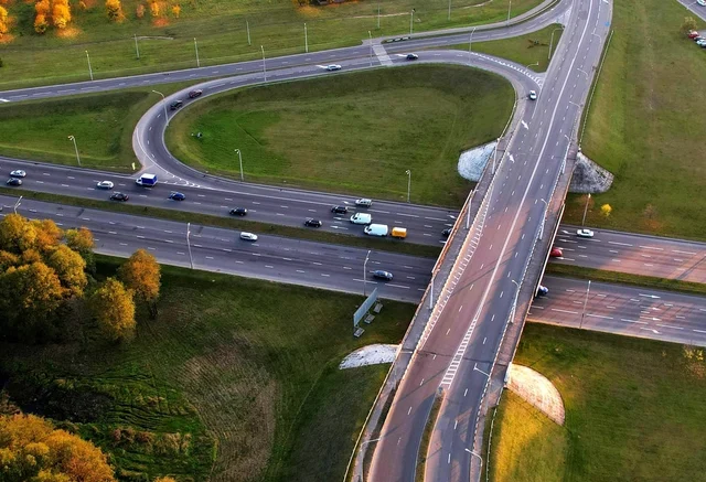 A winding road surrounded by lush greenery.