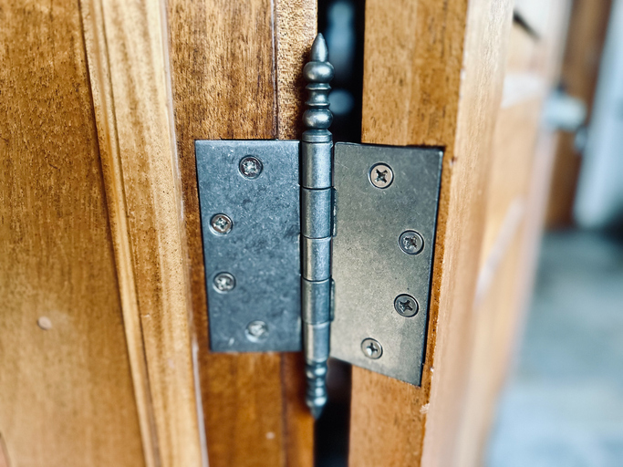 A close-up of a door hinge
