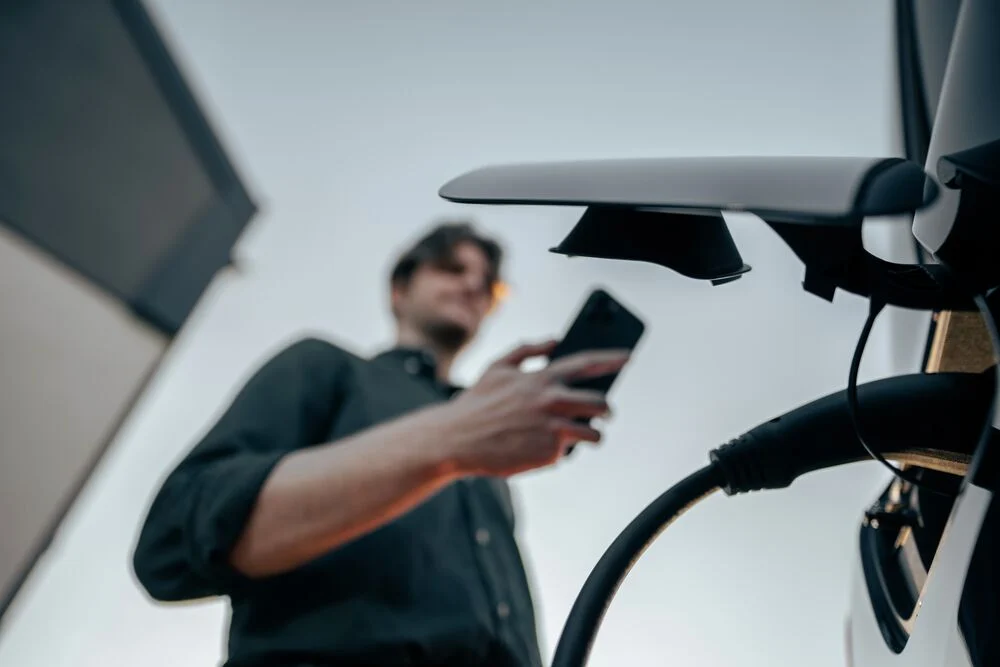 A man is charging his EV using EVBox Livo.