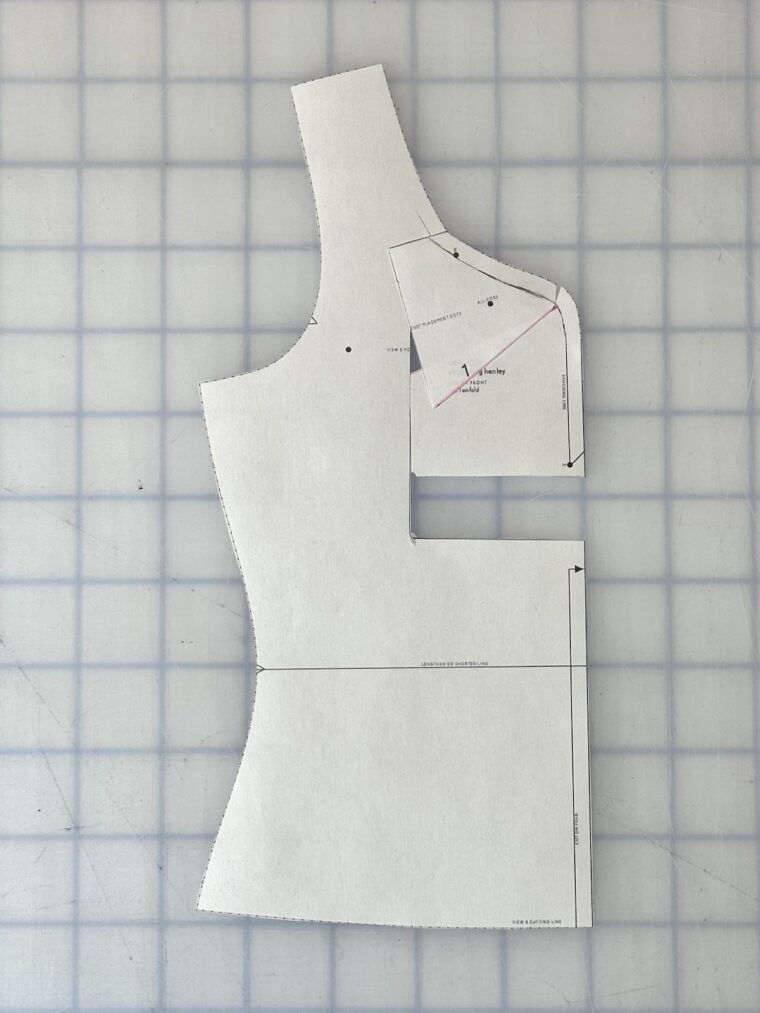 Front bodice pattern piece with a rectangle drawn around the center front neckline. The rectangle has been shifted upward. The top of the rectangle has been angled to blend with the original neckline.