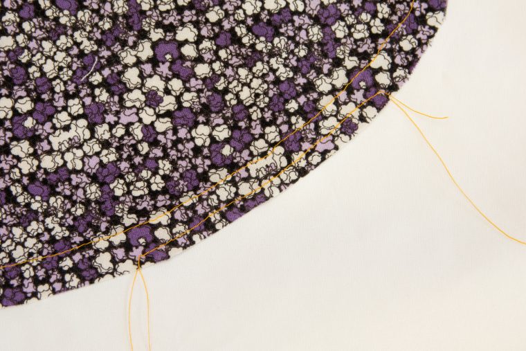 Narrow double fold hem on a curve
