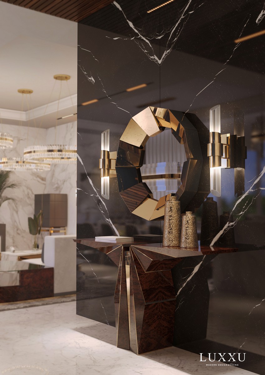 contemporary entryway with a black console table and a golden mirror