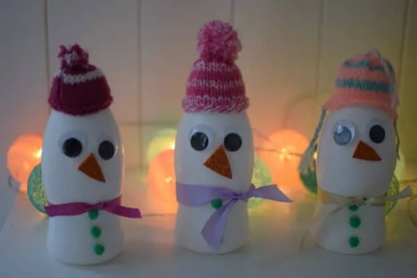Snowmen made from milkshake bottles
