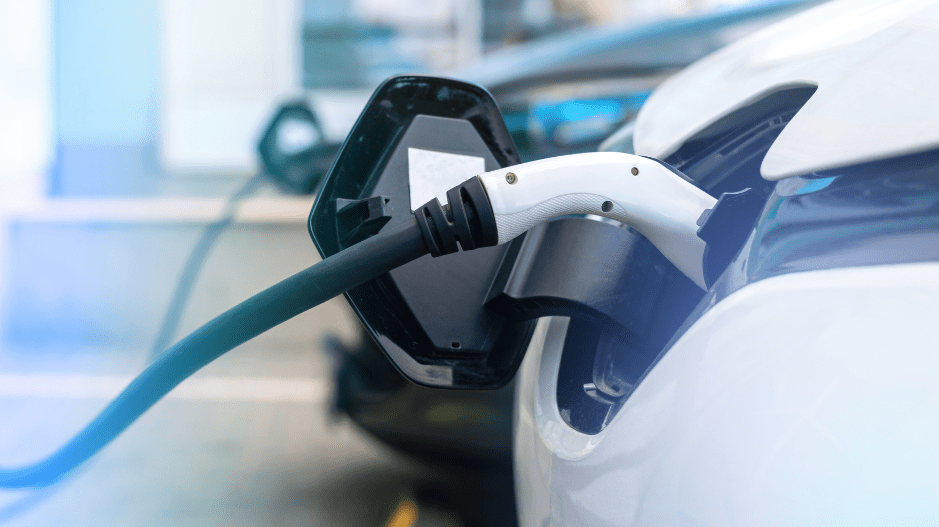 White electric car being charged.
