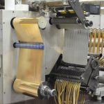 ProÂ® Sheen being slit on a narrow web slitter
