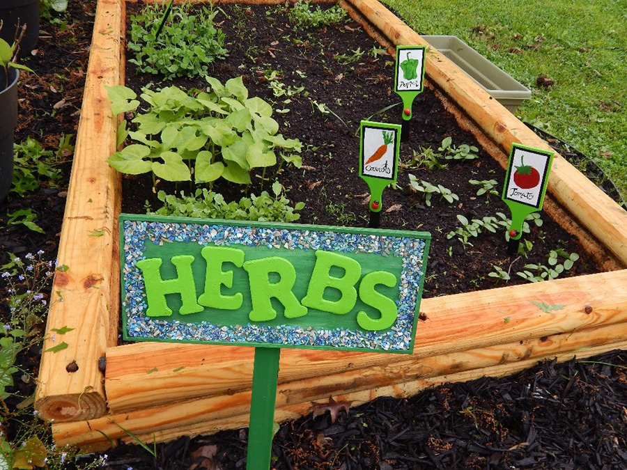 Finished Garden with garden and veggie label signs