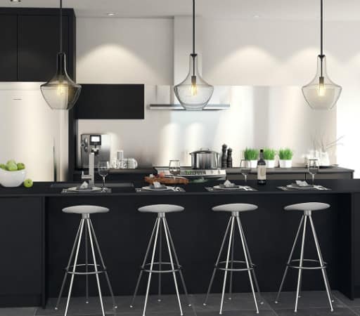 A modern black kitchen with stools