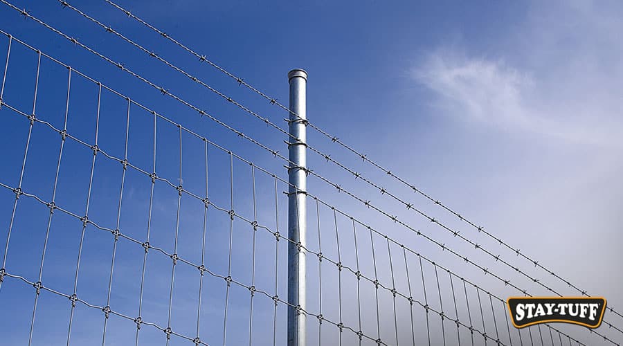 Adding barbed wire or electric wire to an existing fence enhances security