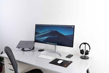 Image of a desk with wireless mouse and keyboard
