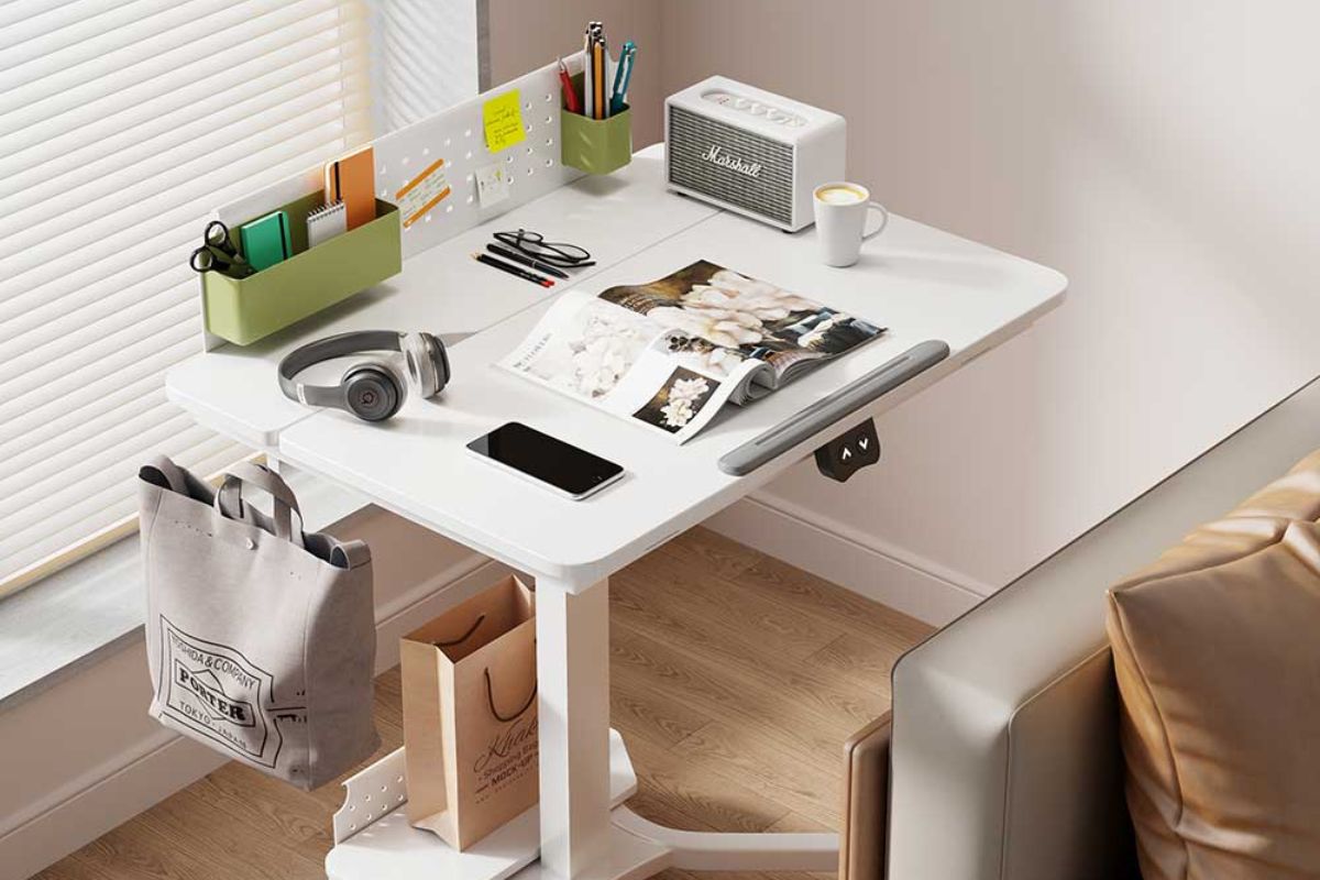 An adjustable desk featuring a pegboard organiser, stationery holders, and space for personal items.