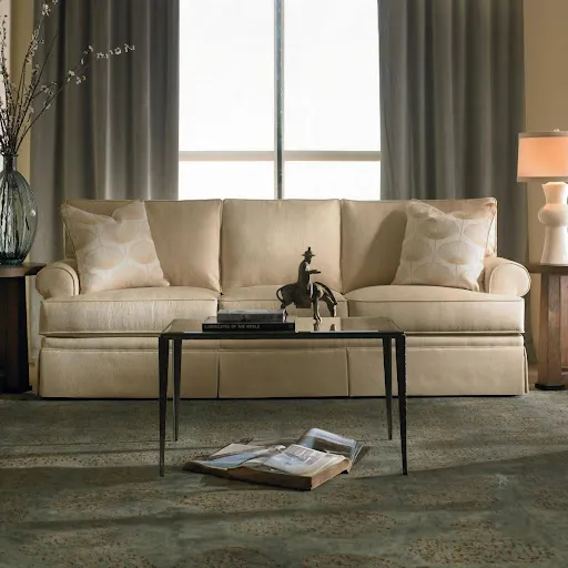 Elegant beige sofa with decorative pillows in a cozy living room setting
