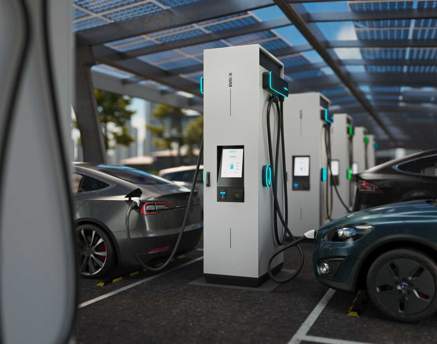 EVBox Troniq Modular charging multiple vehicles in a parking lot.