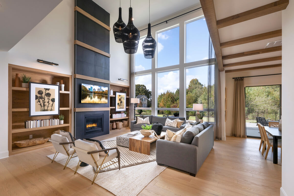 Spacious great room with ample natural light from two-story windows